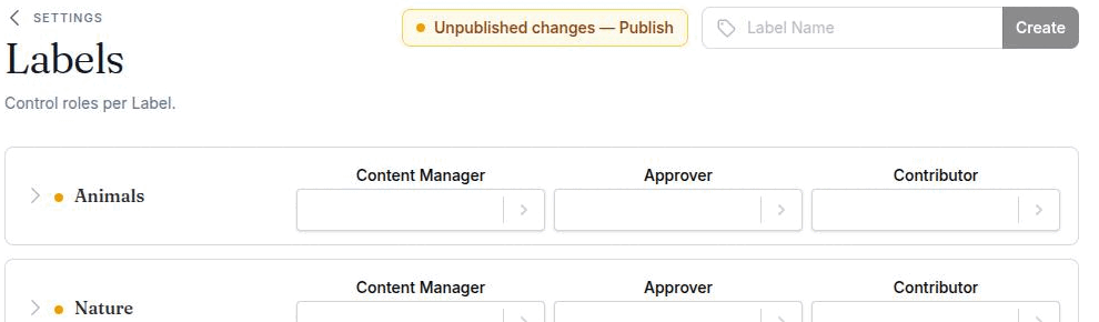 Settings → Labels showing the amber publish banner and a dot beside a changed label